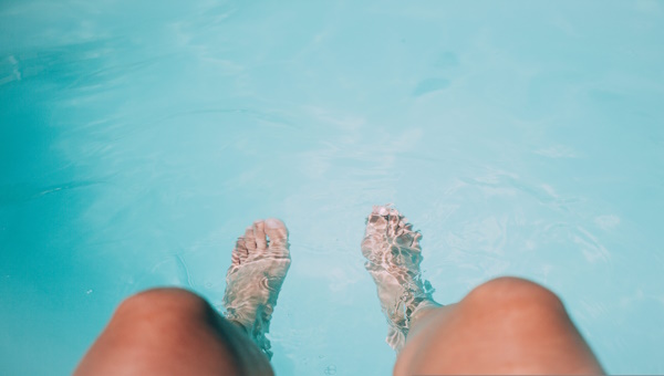 Legs and feet in water